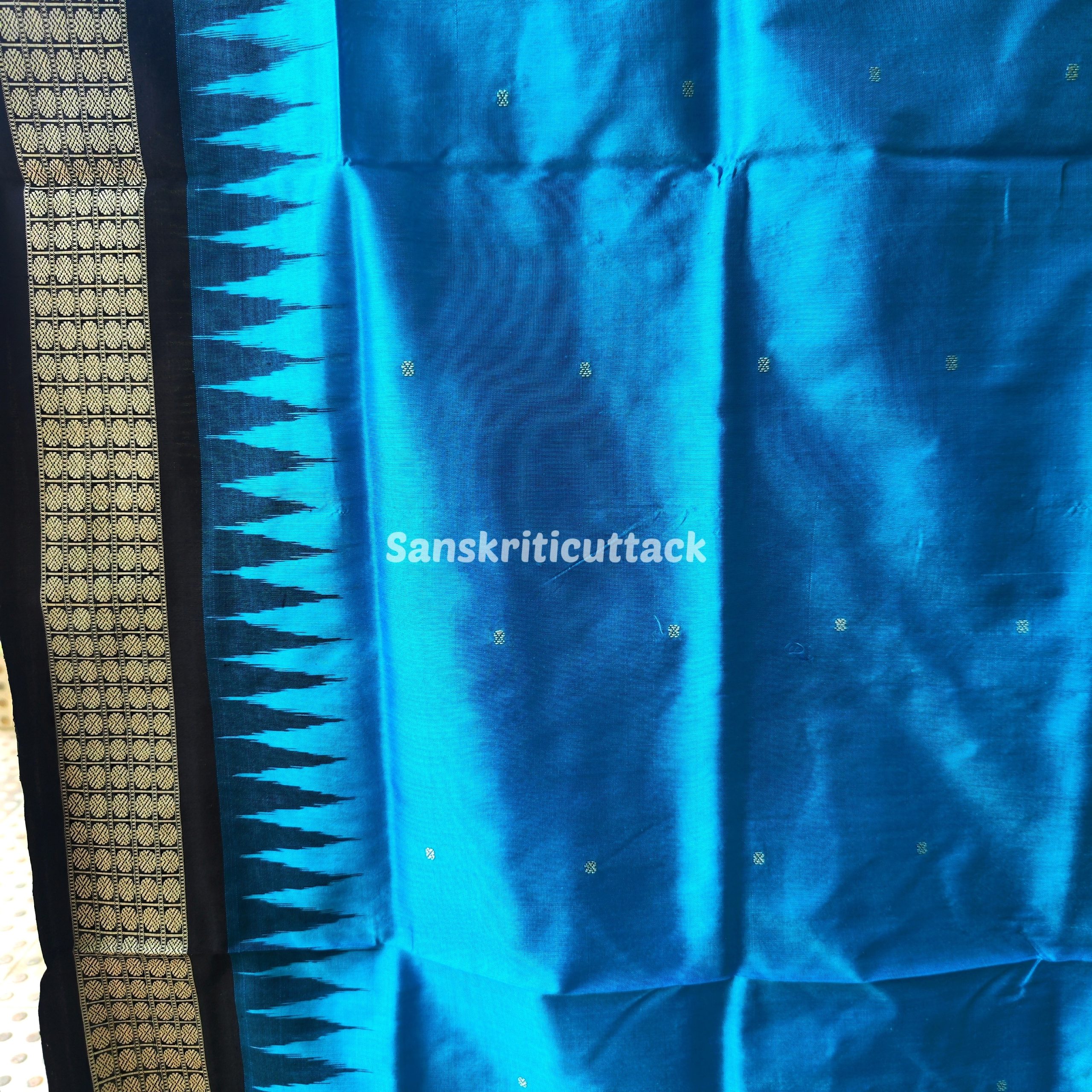 Photo_1731318223583 handloom Bomkai silk saree, traditional Odisha saree, authentic Bomkai silk, Bomkai pata saree, handloom silk saree, Odisha handloom saree, copper sulfate Bomkai saree, saree for special occasions, Bomkai silk saree with blouse, black border saree, elegant handloom saree, silk saree for festive wear, designer Bomkai saree, black pallu Bomkai saree, traditional handloom Bomkai, copper sulfate saree for events, handcrafted Bomkai saree, saree for women, buy Bomkai silk saree, online Bomkai saree shopping, Odisha silk saree, saree with kumbha border, black and copper saree, premium Bomkai saree, wedding Bomkai silk, ethnic wear for women, luxury Bomkai silk