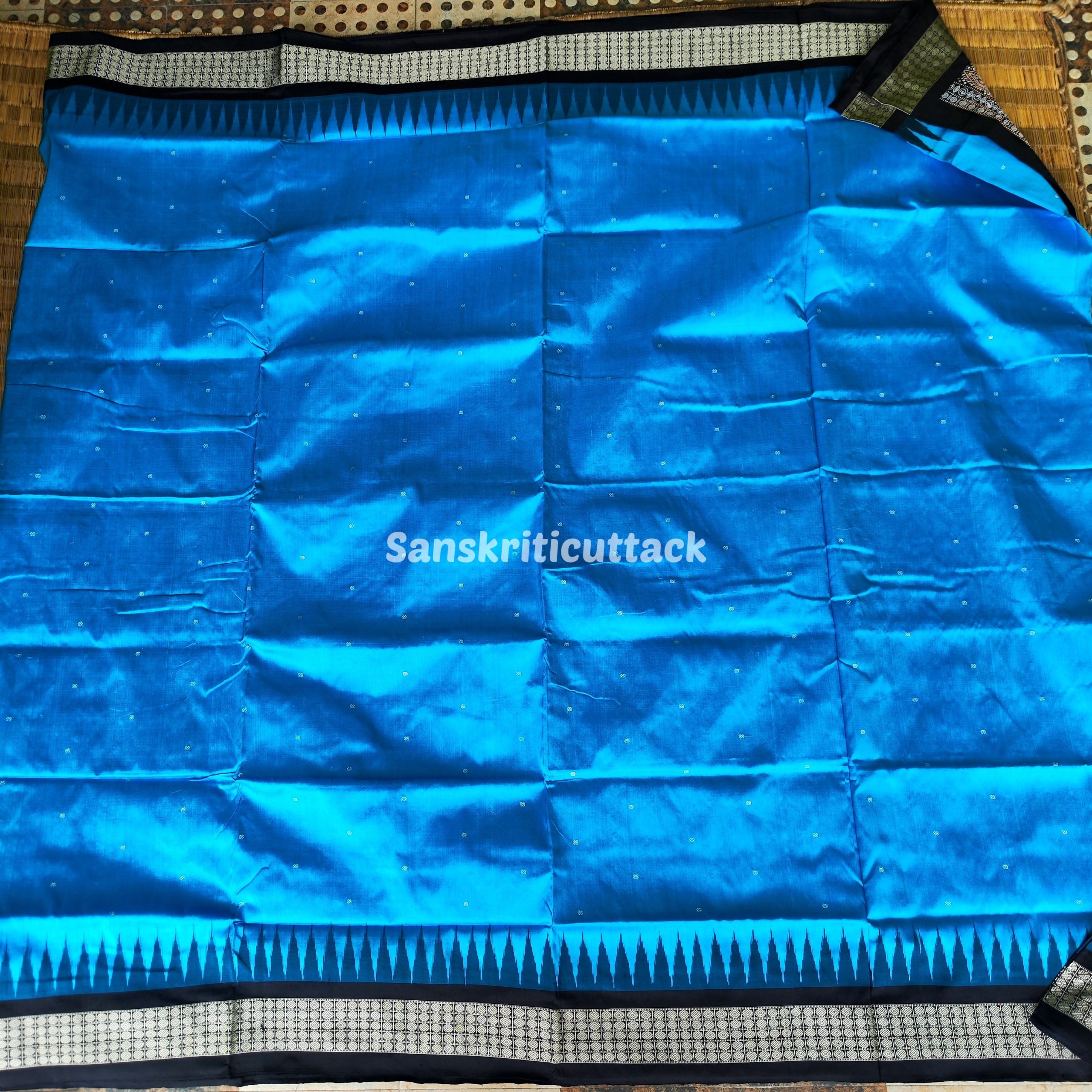 Photo_1731318224586 handloom Bomkai silk saree, traditional Odisha saree, authentic Bomkai silk, Bomkai pata saree, handloom silk saree, Odisha handloom saree, copper sulfate Bomkai saree, saree for special occasions, Bomkai silk saree with blouse, black border saree, elegant handloom saree, silk saree for festive wear, designer Bomkai saree, black pallu Bomkai saree, traditional handloom Bomkai, copper sulfate saree for events, handcrafted Bomkai saree, saree for women, buy Bomkai silk saree, online Bomkai saree shopping, Odisha silk saree, saree with kumbha border, black and copper saree, premium Bomkai saree, wedding Bomkai silk, ethnic wear for women, luxury Bomkai silk